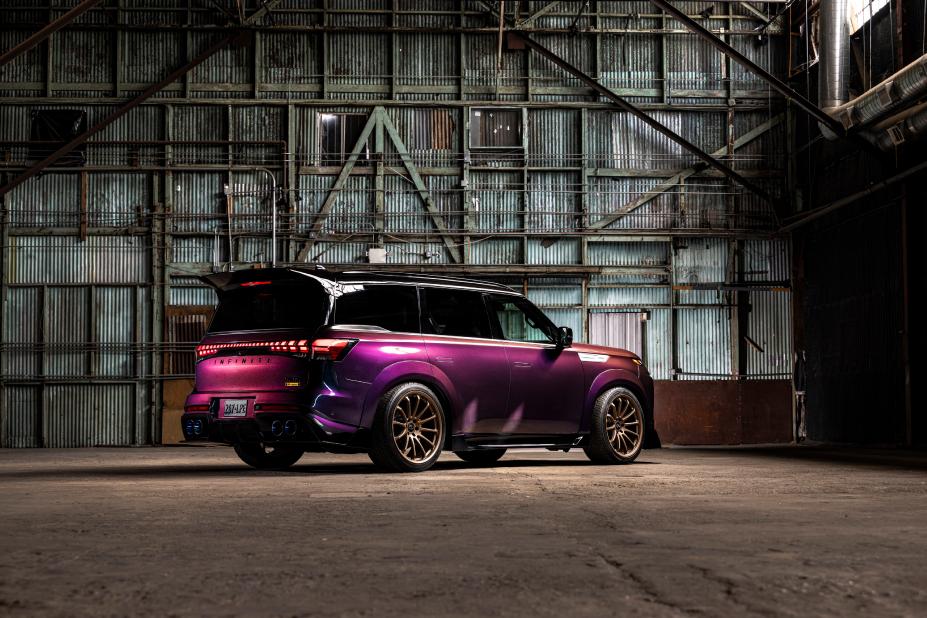 Right rear view of the INFINTI QX80 R-Spec build parked inside a warehouse.