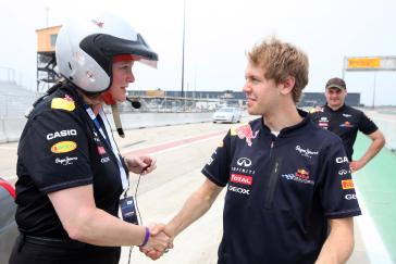 FORMULA ONE WORLD CHAMPION SEBASTIAN VETTEL PUTS WENDY DURWARD AND INFINITI IPL TO THE TEST ON THE TRACK