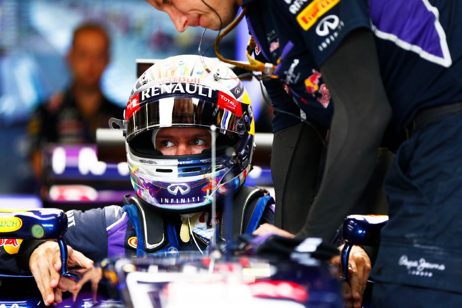 A close up on the Red Bull Infiniti driver getting into his car.
