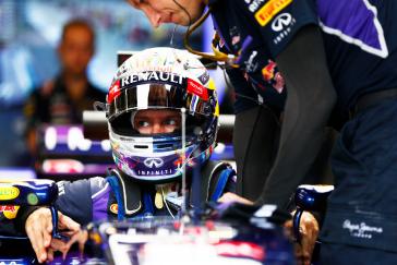 A close up on the Red Bull Infiniti driver getting into his car.