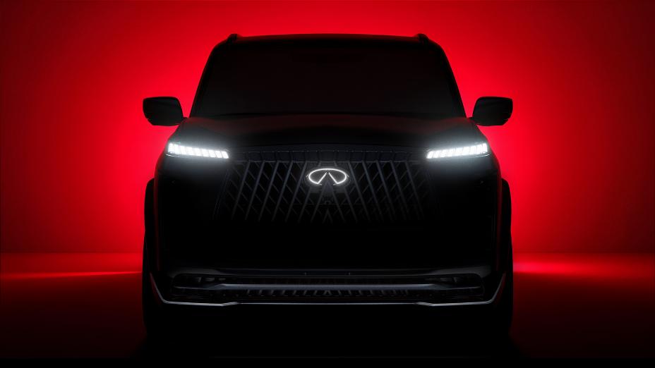 Front view of an INFINITI SUV Concept, it is back lit with red light.