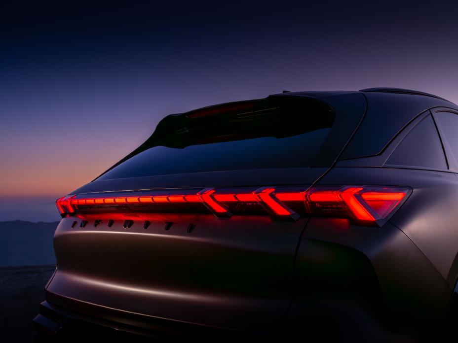 Angled close up of the rear side of the QX65 Monograph, taillights are illuminated.