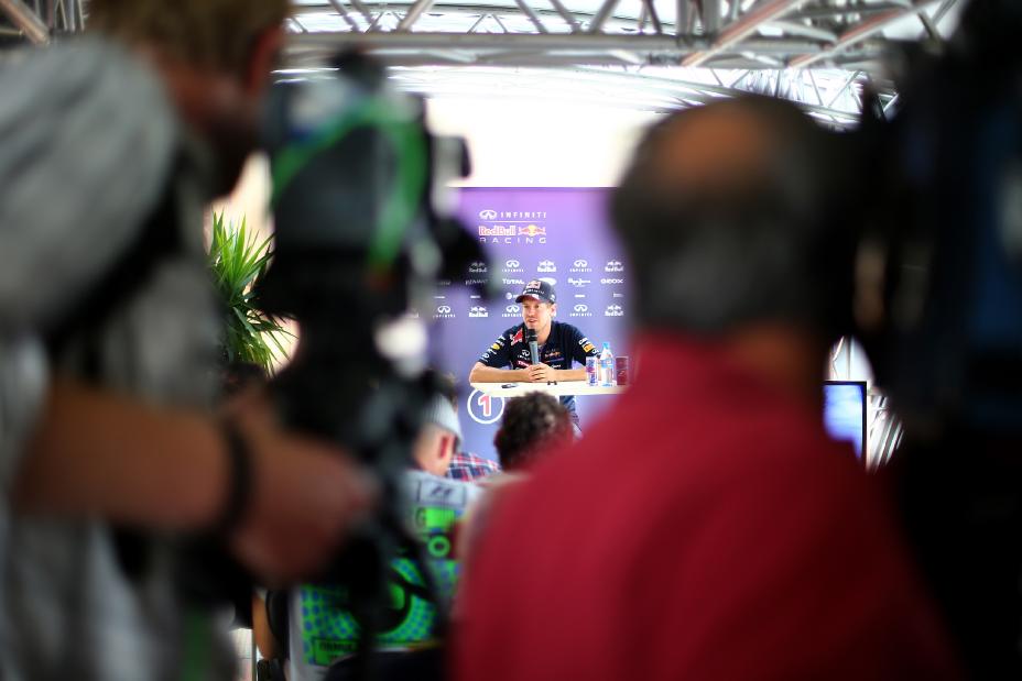 INFINITI team member speaking into a microphone on stage