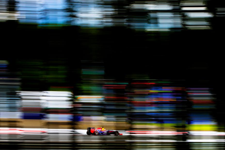 Side view of the Infiniti car driving on the race track.