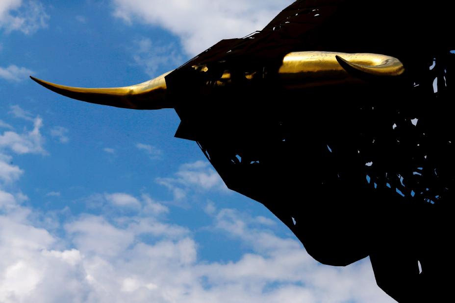 Image of a bull statue with gold horns
