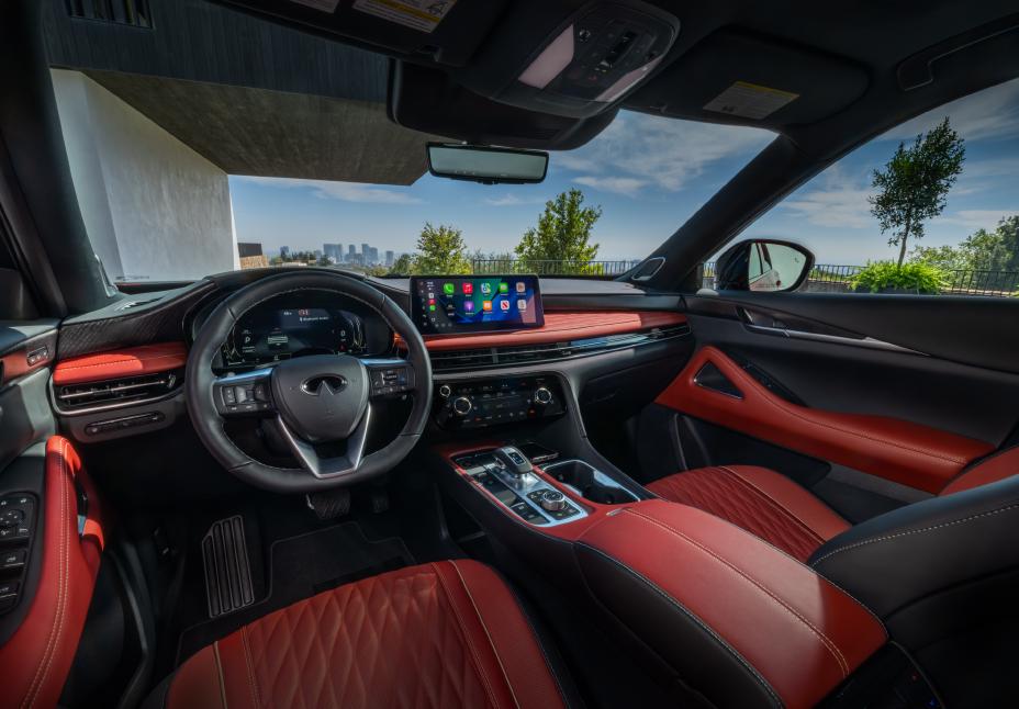 The steering, dashboard and windshield inside the 2027 INFINITI QX65.