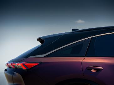 Close up profile view of the rear 1/4 half of the QX65 Monograph at sunset.