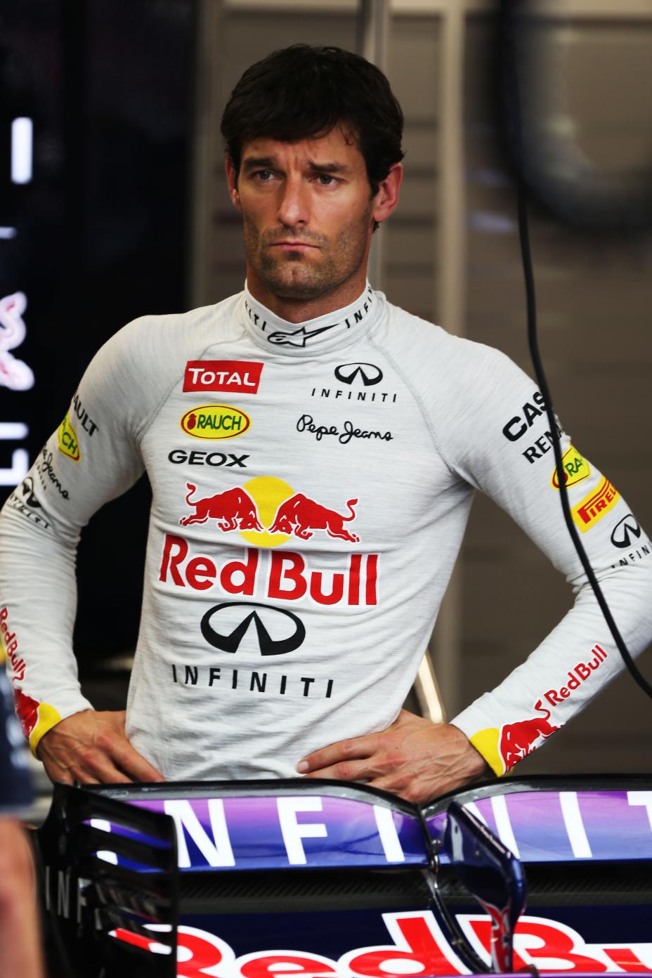 Infiniti driver wearing a white pull over.