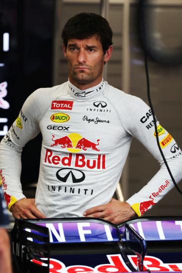 Infiniti driver wearing a white pull over.