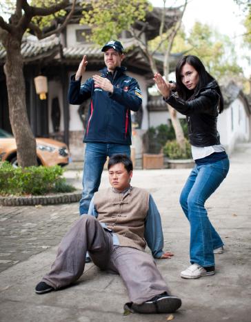 Formula One World Champion Sebastian Vettel appears alongside Hollywood actress and martial artist Celina Jade at a Shanghai film studios, China, for the making of car brand INFINITI's martial arts short film, "Kung Fu Vettel: Drive of the Dragon" . The film is the first in a series of virals from INFINITI to launch their Inspired Performers campaign on 11th April 2012. Photo by Victor Fraile / The Power of Sport Images for Prism/INFINITI