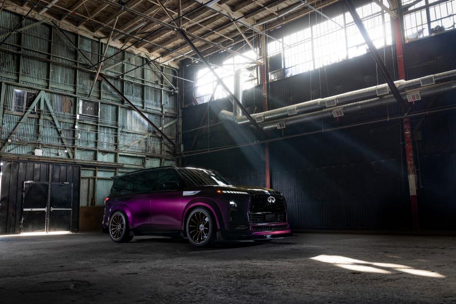Front right 3/4 angle of the INFINITI QX80 R-Spec build parked in a warehouse.