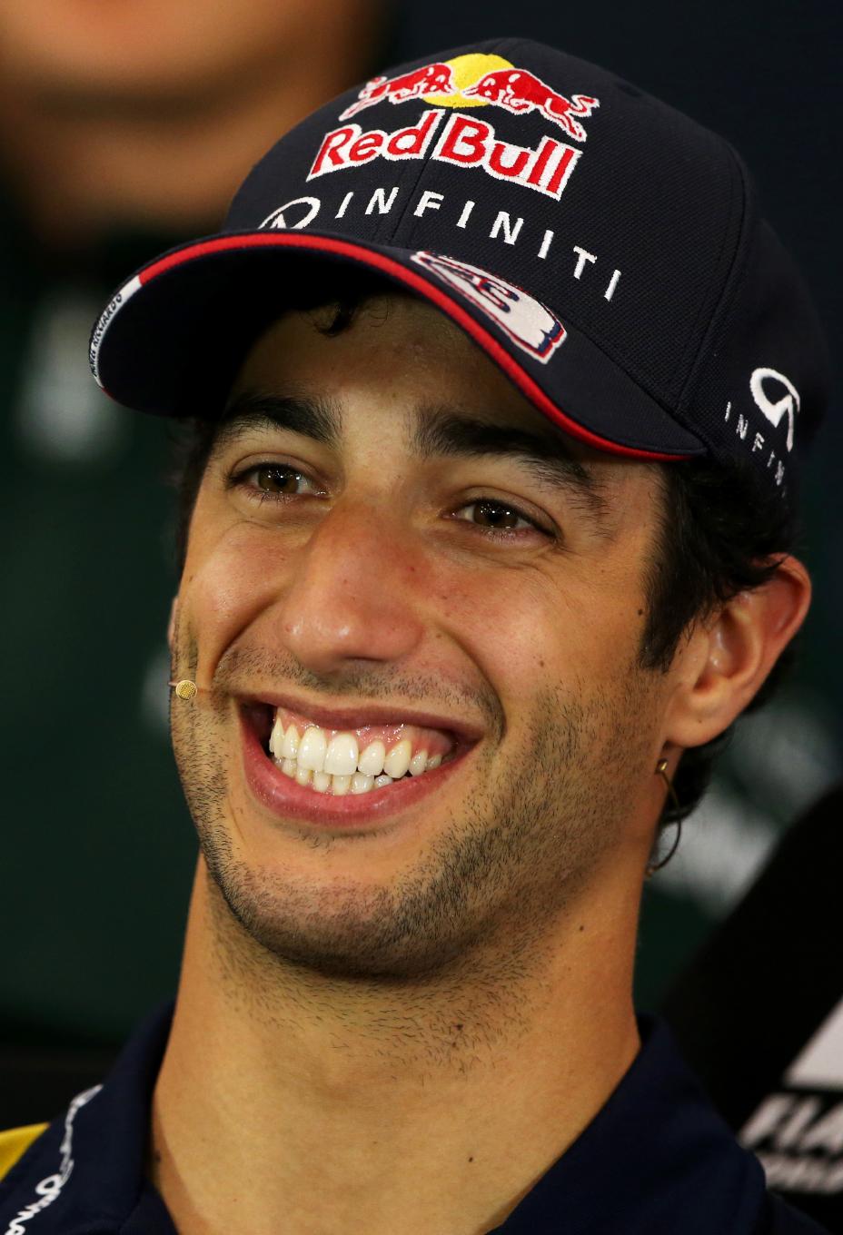 Headshot of INFINITI driver in a baseball cap smiling