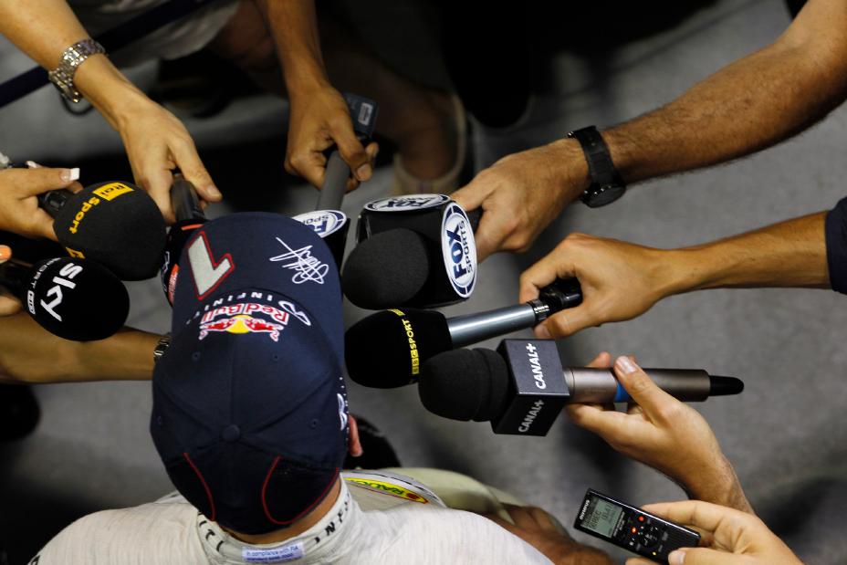 A person wearing Infiniti team hat 1 doing an interview.