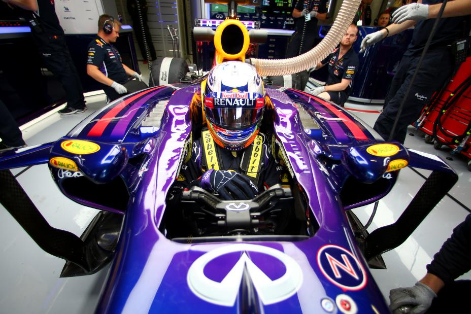 INFINITI driver inside racer, helmet on, ready for action