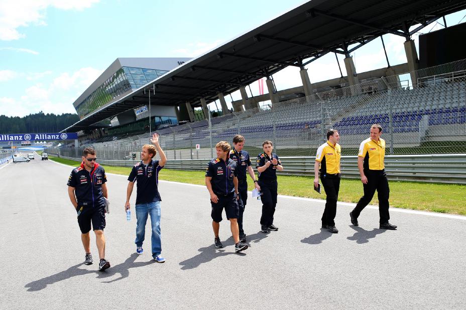 Group of 7 people walking down the race track