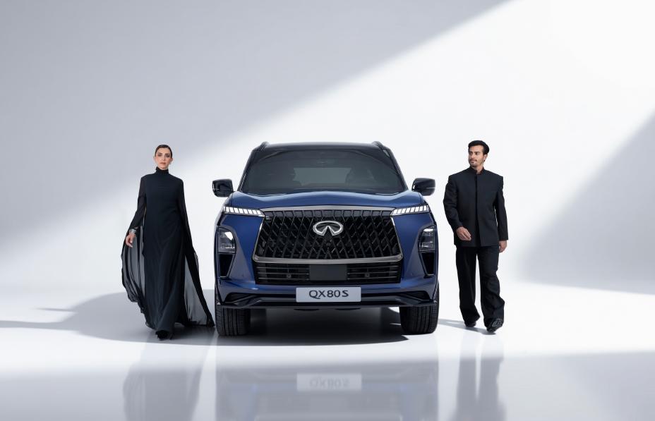 Full front view of the QX80S with two people walking alongside it
