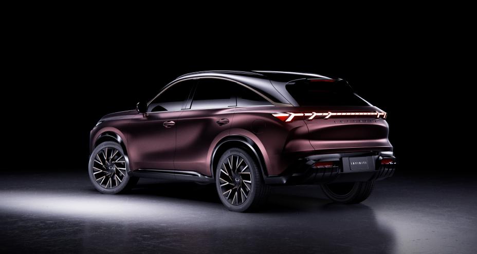 Left rear 3/4 view of the QX65 Monograph in a dark room with minimal light.