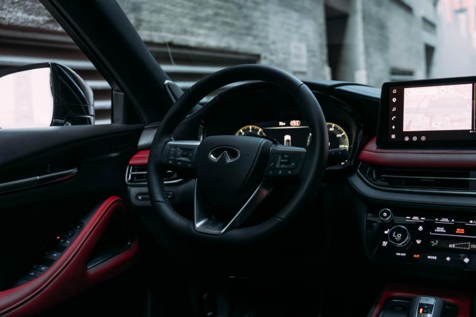 Infiniti vehicle receiving scheduled maintenance service