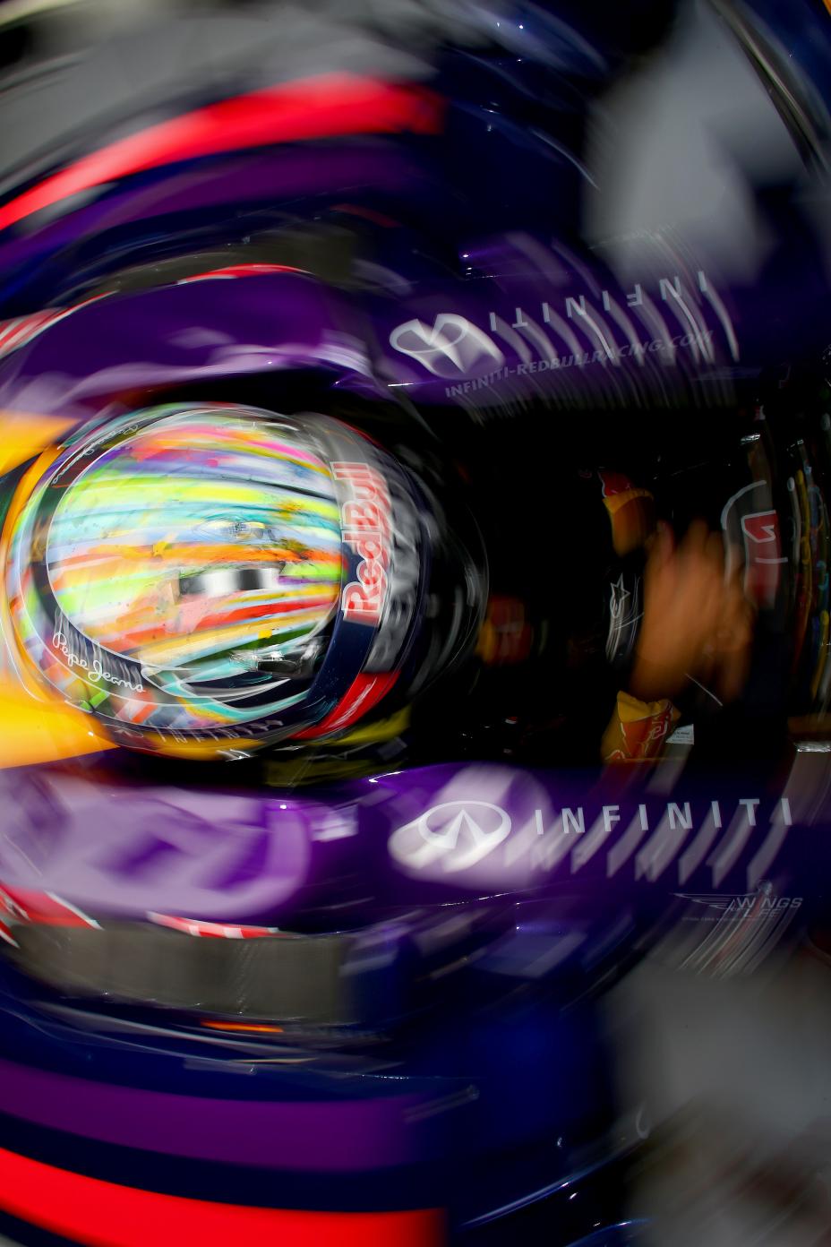 Looking down at the top of the helmet of a Infiniti F1 driver.