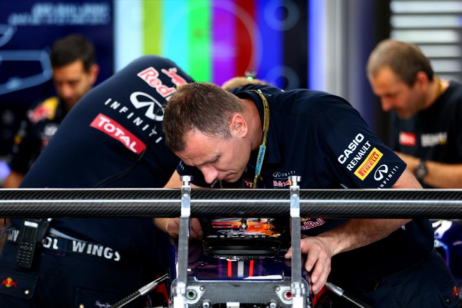 INFINITI team members inspecting the racer