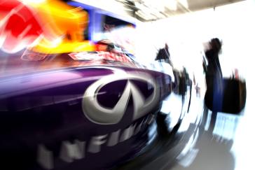 A blurry INFINITI logo