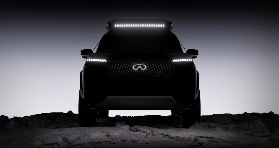 Front view of an INFINITI Concept, the headlights and emblem are illuminated, a light bar is attached to the roof.
