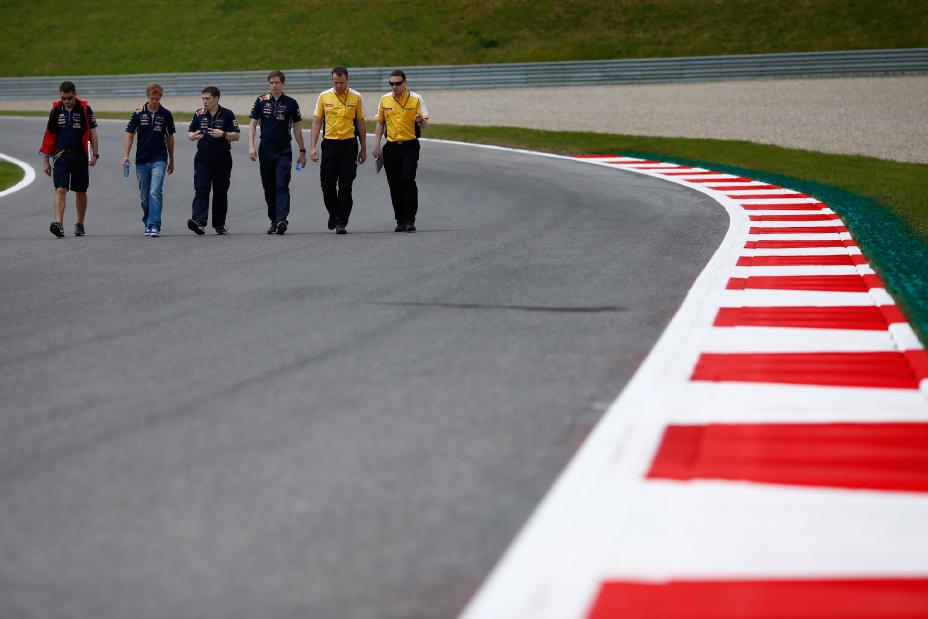 Group of 6 people walking down the race track