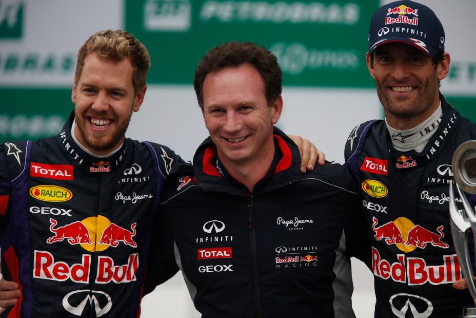 Three men with their arms around each other