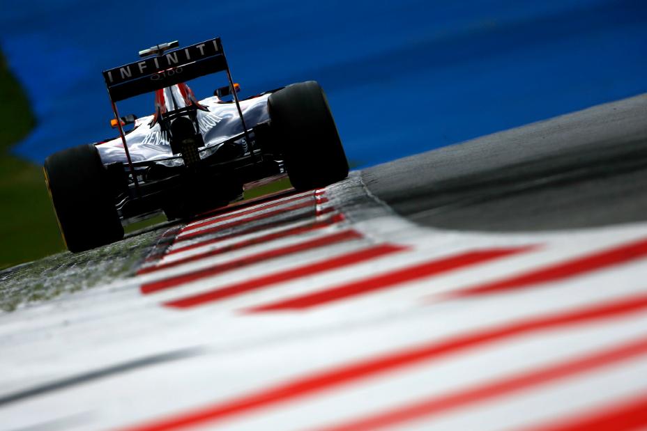 F1 car driving on the side of the track.