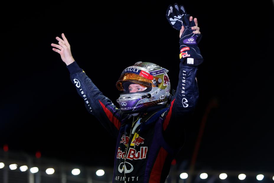 Infiniti driver celebrating with his hands up.