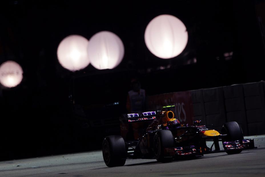 Night time view of Infiniti F1 car driving at the Singapore Grand Prix.