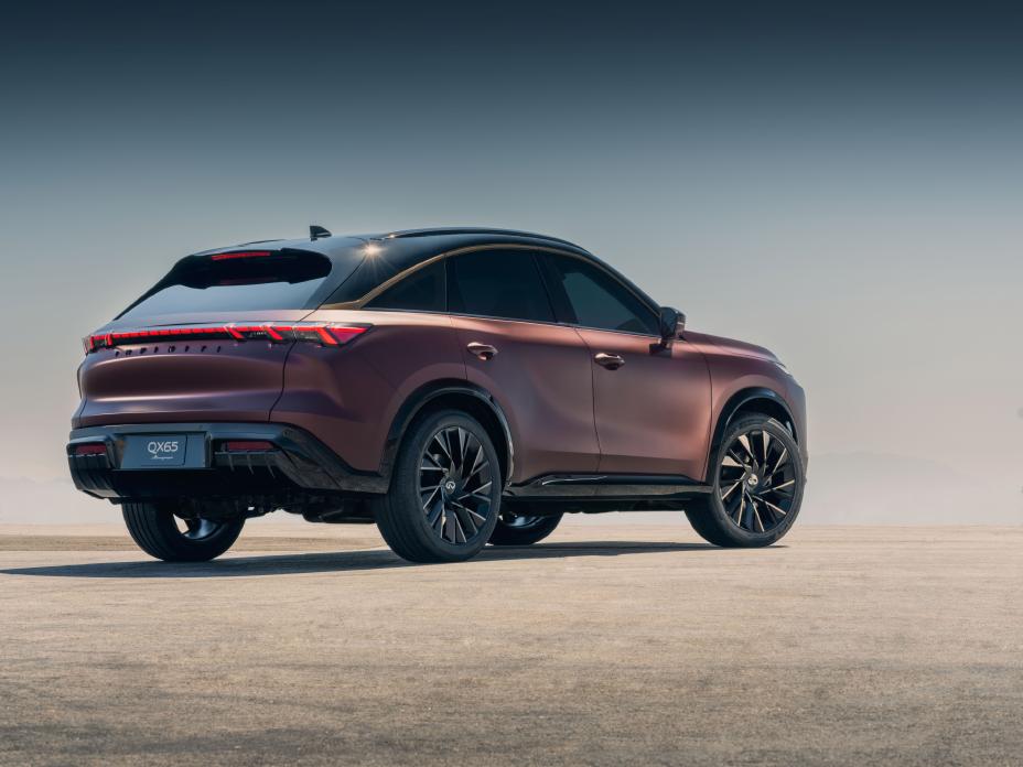 Rear 3/4 angle of the QX65 Monograph parked on concrete.