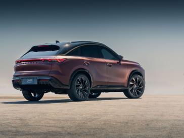Rear 3/4 angle of the QX65 Monograph parked on concrete.