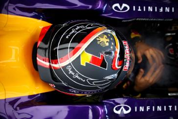 Aerial view of a drivers helmet while he is in his vehicle