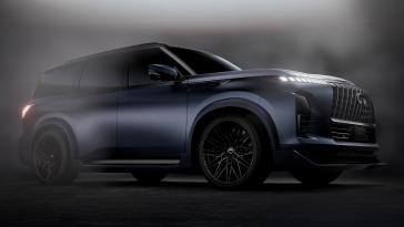Lower angled view of the INFINITI QX80 Track Spec with a smoky haze floating around the vehicle.