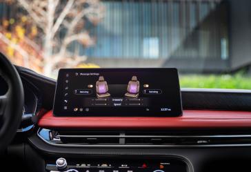 Close up of the center display screen, featuring seat controls, inside the 2027 INFINITI QX65.