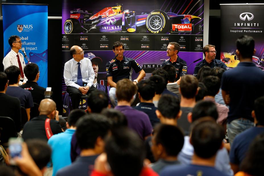 Members of the Red Bull racing team doing an interview.