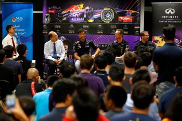 Members of the Red Bull racing team doing an interview.