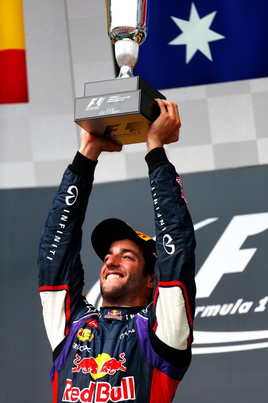 Infiniti Red Bull driver holding up the trophy.