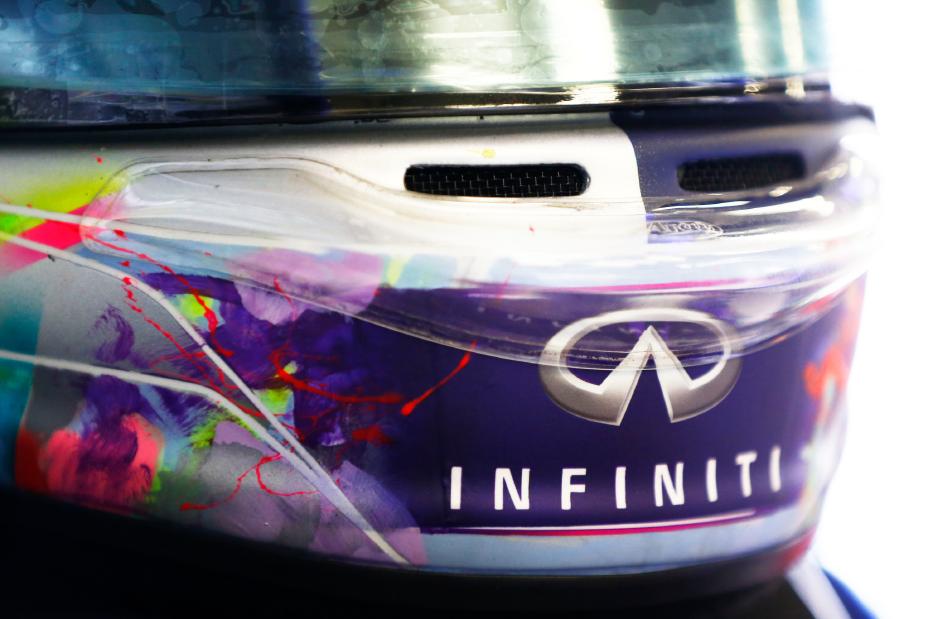INFINITI insignia present on the back of a drivers helmet