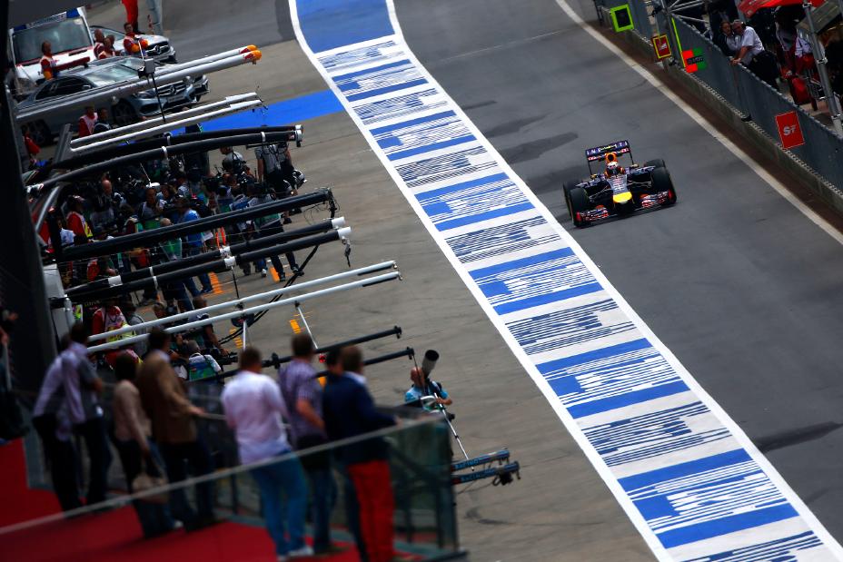 F1 Infiniti race car driving up through the pit lane.