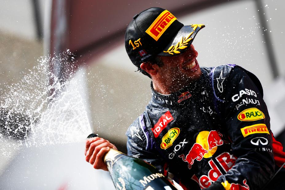 Infiniti driver celebrating with champagne.