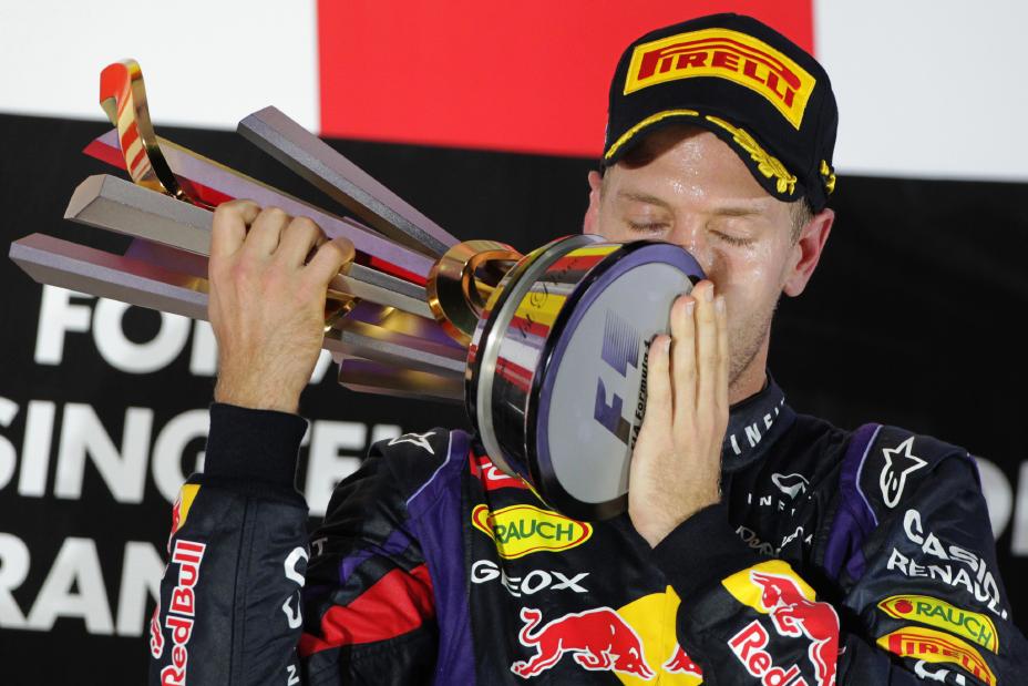 Infiniti Red Bull driver kissing the trophy.