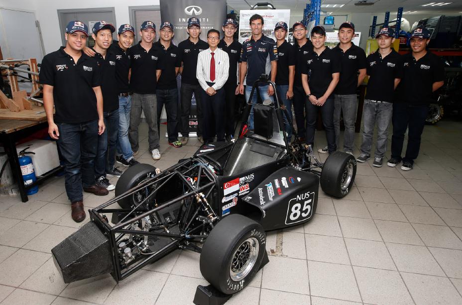 Group photo in front of car.