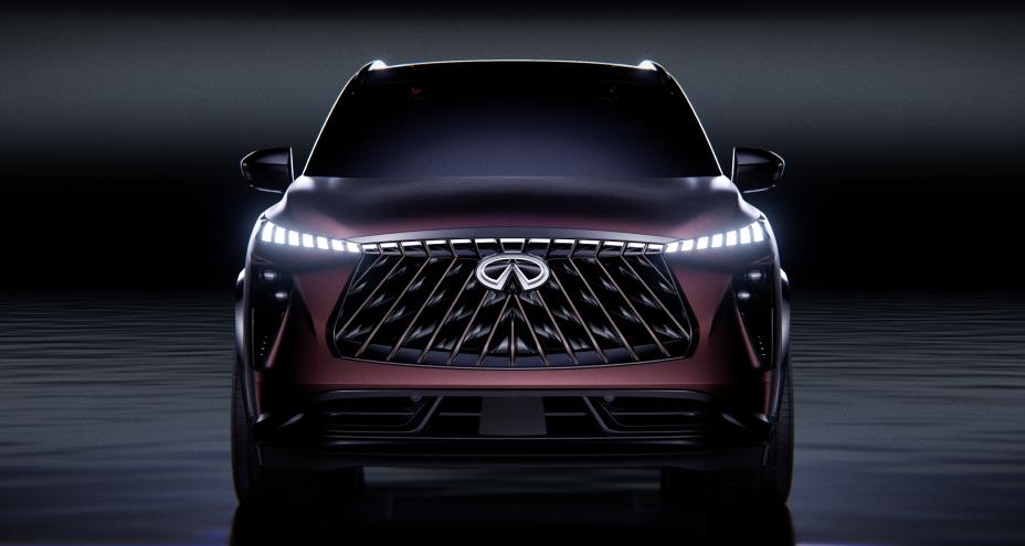 Front view of the QX65 Monograph in a dark space, the headlights are illuminated.