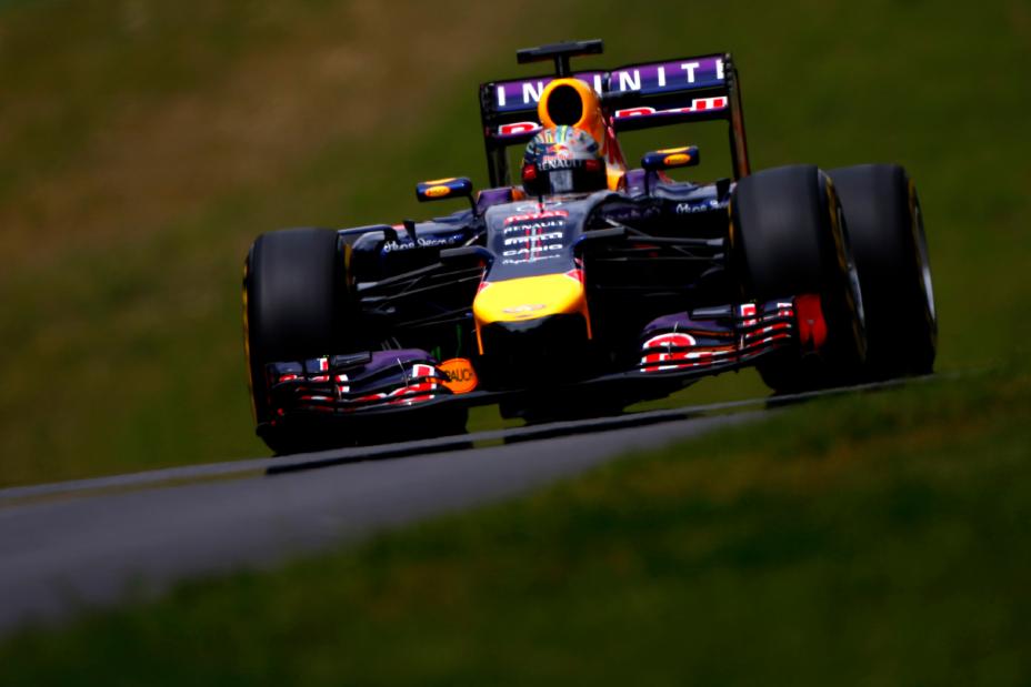 A down-low photo of an F1 driving towards the camera