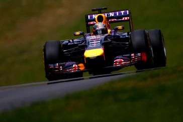 A down-low photo of an F1 driving towards the camera