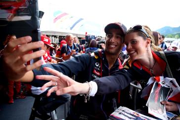 INFINITI driver taking a selfie with a woman at the signing table