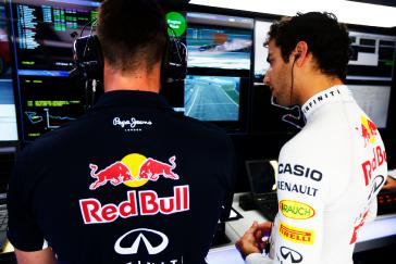 F1 Red Bull team collaborating.