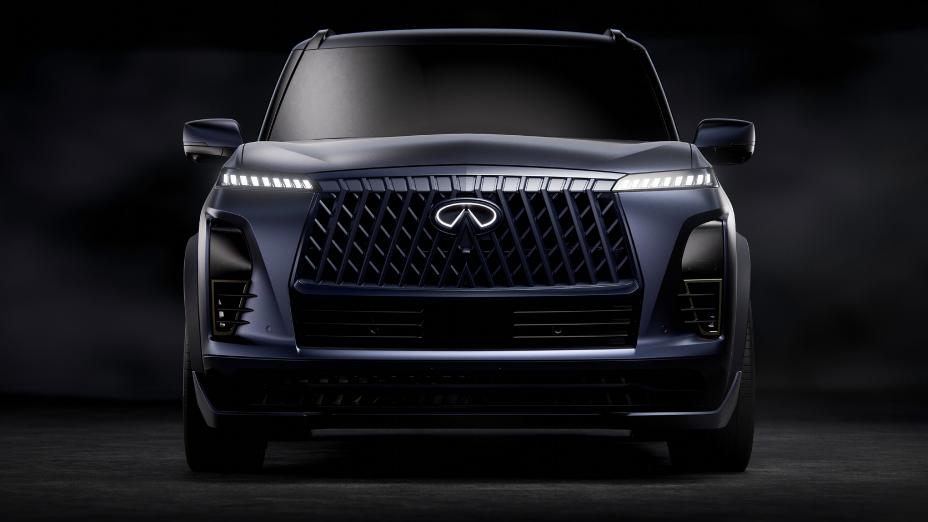 Front view of the INFINITI QX80 Track Spec, the headlights and emblem of illuminated.